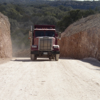Cut road to grade